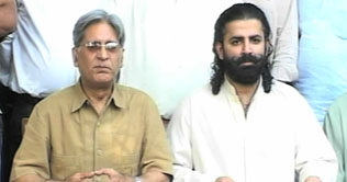 Aitzaz Ahsan demands Musharrafs trial 